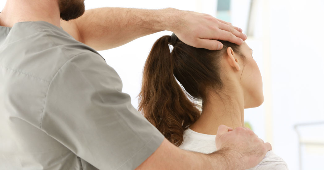 Woman being treated for neck issues by professional